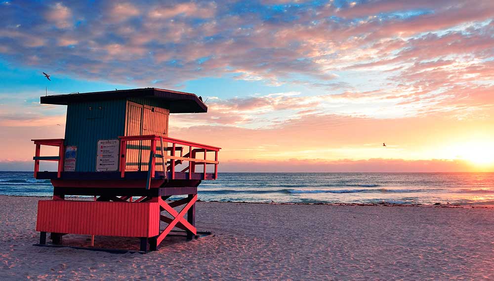 Lifeguard tower on a beach at sunset